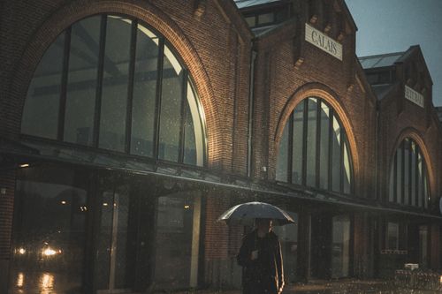 Man standing in front of fish market