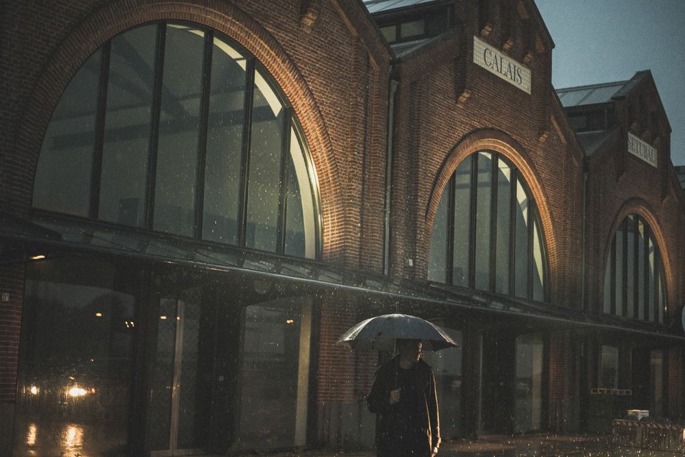 Man standing in front of fish market