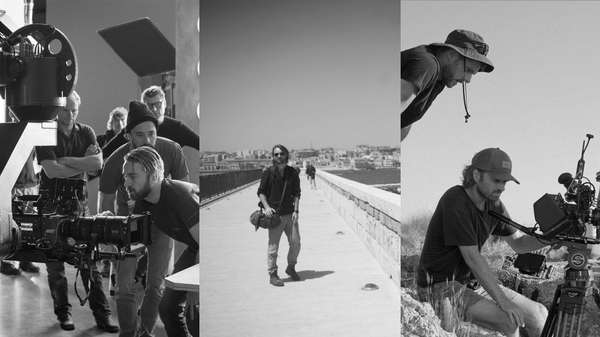 person standing at medium distance behind camera in open plain