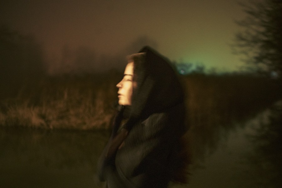 woman with headscarf surrounded in fog